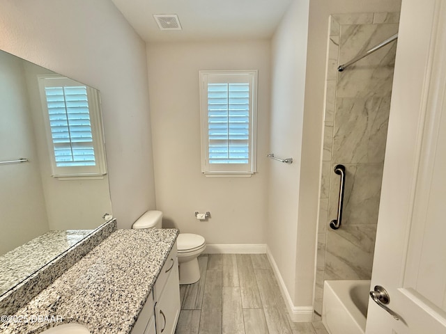 24 Shear Water Trl, Ormond Beach, FL 32174 - bathroom featuring vanity, plenty of natural light, wood finished floors, and toilet