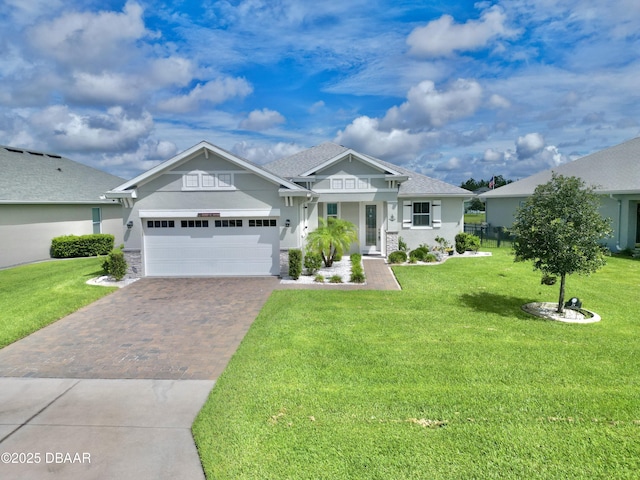 24 Shear Water Trl, Ormond Beach, FL 32174 - craftsman inspired home with decorative driveway, a garage, a front lawn, and stucco siding