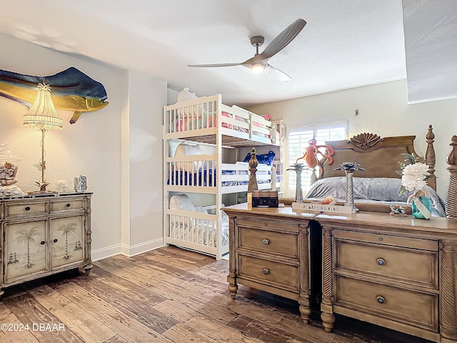 bedroom with ceiling fan and dark hardwood / wood-style flooring