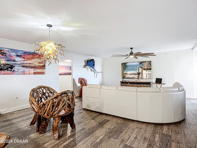 living room featuring ceiling fan and dark hardwood / wood-style flooring