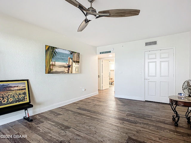 interior space featuring dark hardwood / wood-style flooring and ceiling fan