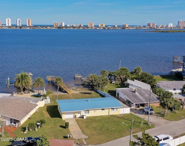 birds eye view of property with a water view