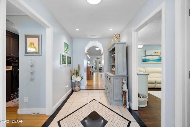 hallway with light hardwood / wood-style flooring