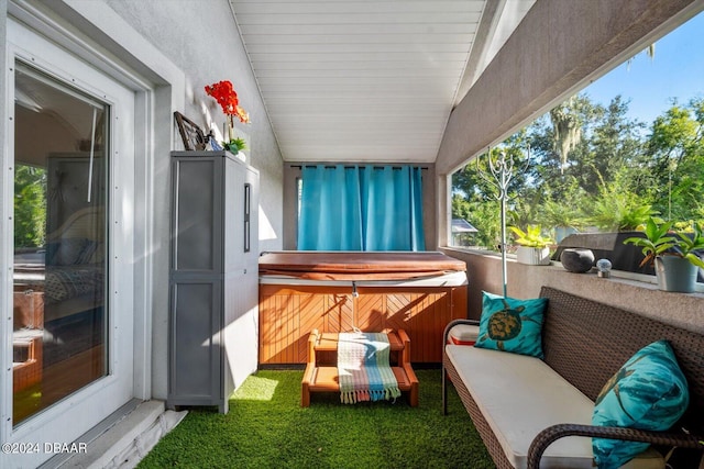 exterior space featuring a hot tub