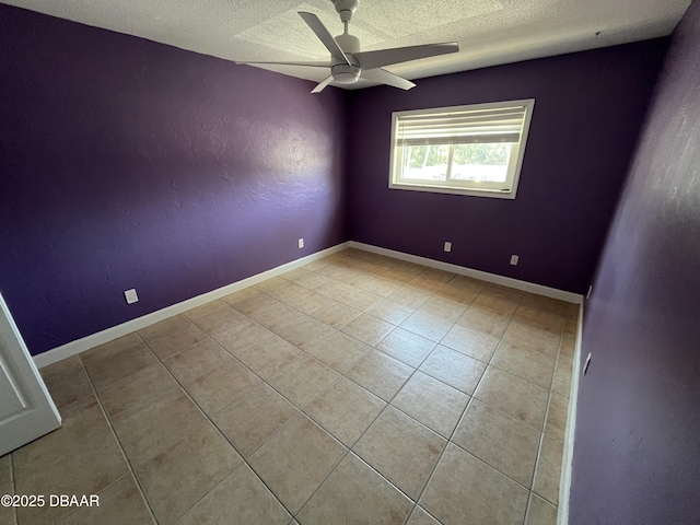 411 N Halifax Ave Unit 203, Daytona Beach, FL 32118 - tiled empty room with a textured ceiling and a ceiling fan