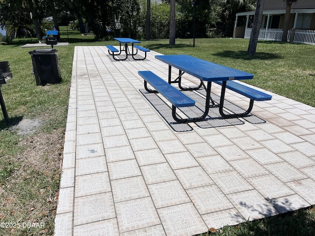 411 N Halifax Ave Unit 203, Daytona Beach, FL 32118 - view of home's community featuring a patio area and a lawn