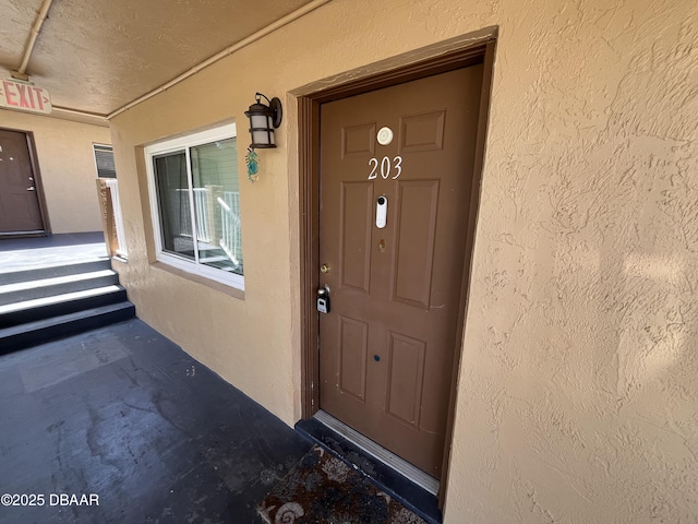 411 N Halifax Ave Unit 203, Daytona Beach, FL 32118 - entrance to property featuring stucco siding