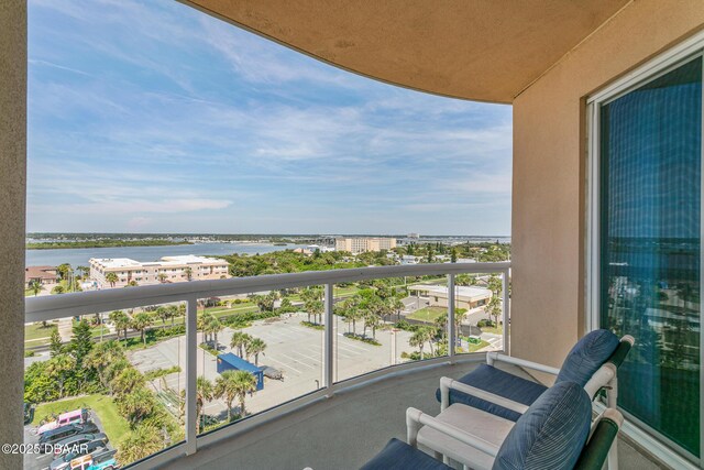 balcony featuring a water view