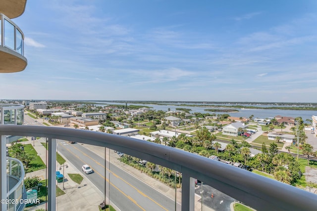 balcony featuring a water view