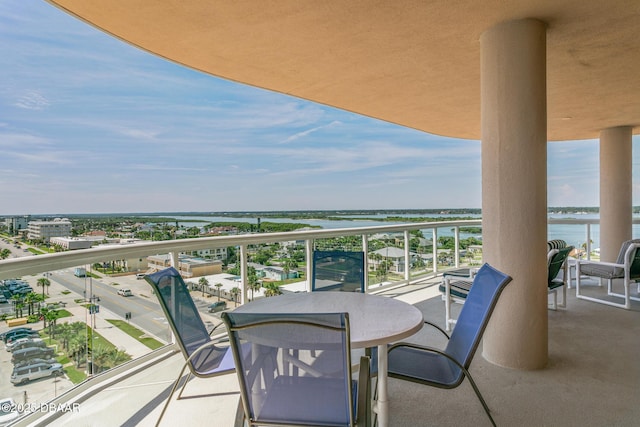 balcony featuring a water view