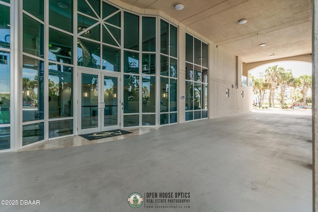 property entrance featuring french doors