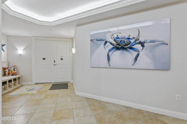 entryway featuring ornamental molding and light tile patterned floors