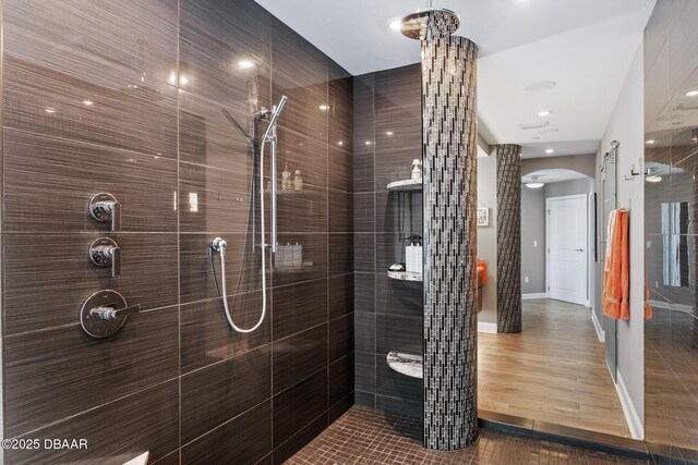 bathroom with a tile shower