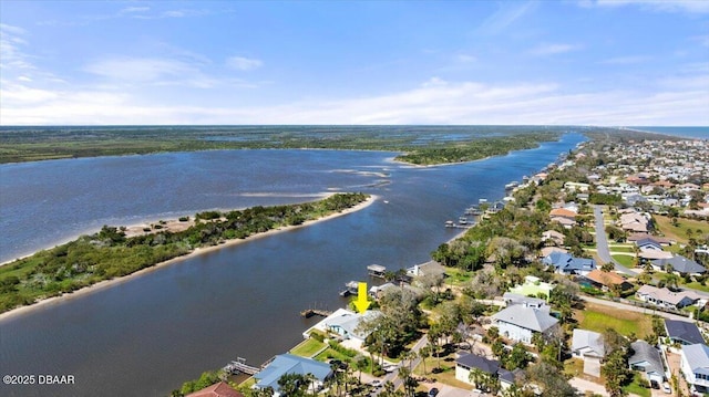 aerial view with a residential view and a water view