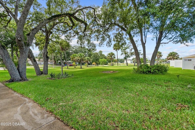view of home's community featuring a yard