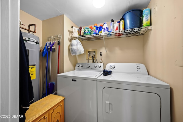 laundry area with water heater and independent washer and dryer