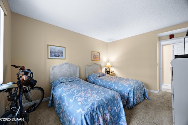 carpeted bedroom featuring white refrigerator