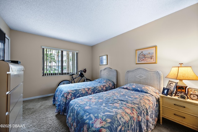 carpeted bedroom featuring a textured ceiling