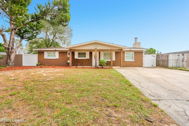 ranch-style house with a front lawn