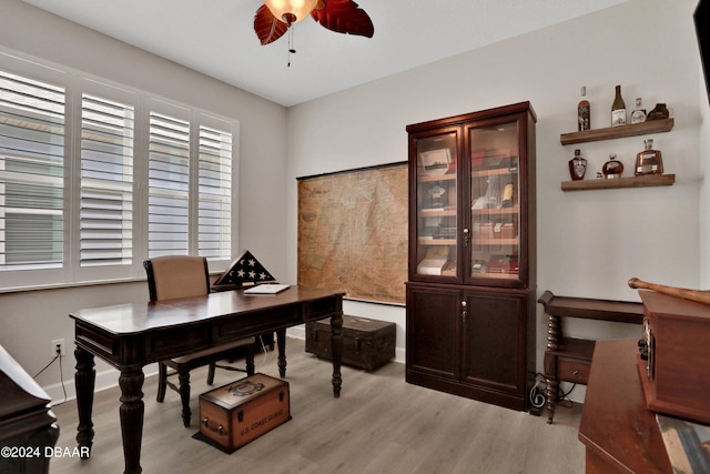 office space featuring light wood-type flooring and ceiling fan