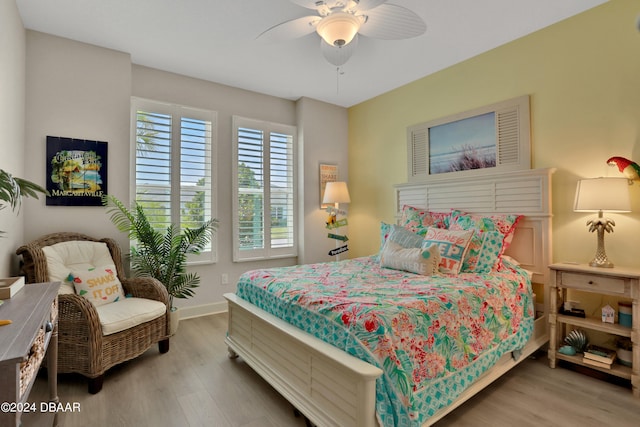 bedroom with hardwood / wood-style flooring and ceiling fan