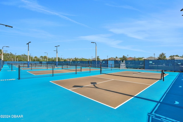 view of sport court with basketball hoop