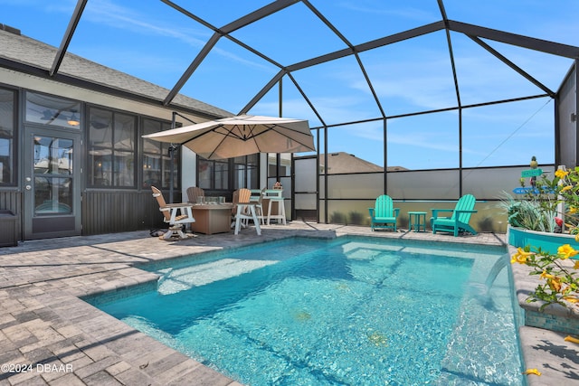 view of pool featuring a lanai, a patio, and pool water feature