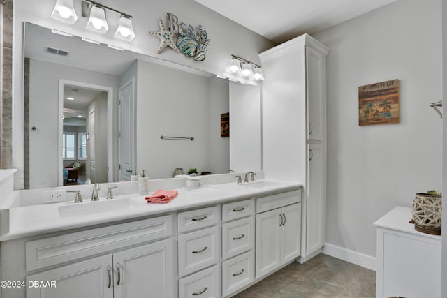 bathroom featuring tile patterned flooring and vanity