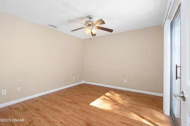 empty room featuring ceiling fan and light wood-type flooring