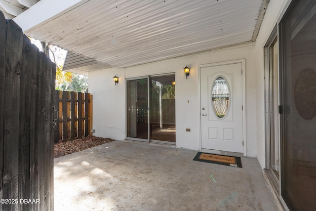 entrance to property featuring a patio area