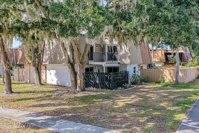 view of front of home with a balcony