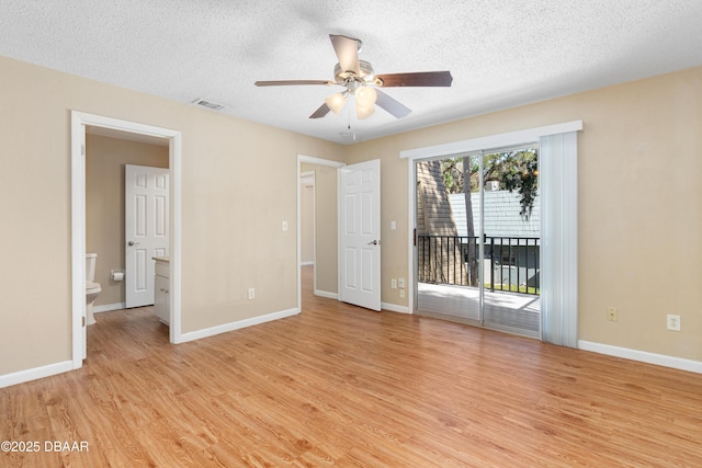 unfurnished bedroom with ceiling fan, access to outside, a textured ceiling, and light wood-type flooring