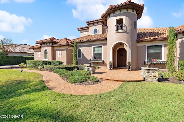 back of house with a lawn