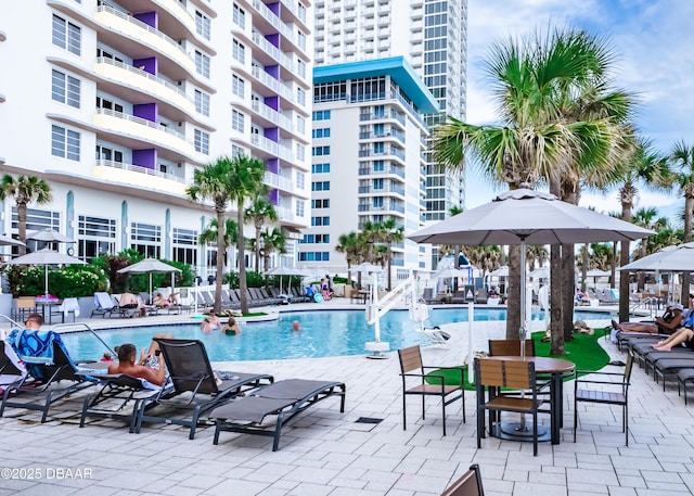 community pool with a patio area