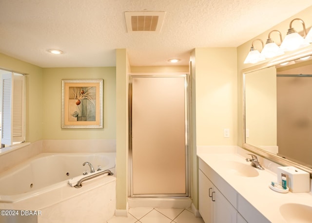 bathroom with a stall shower, a tub with jets, visible vents, and a sink