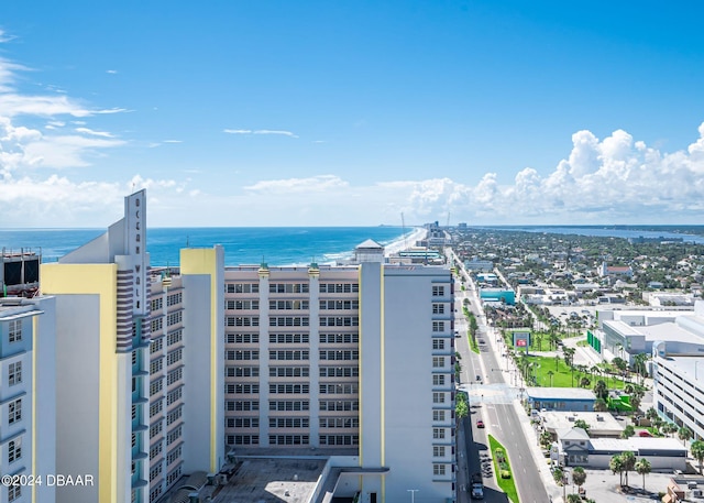 birds eye view of property featuring a water view and a city view