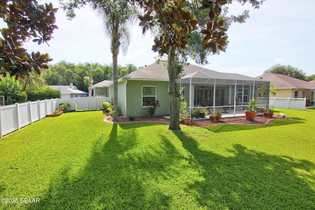 3288 Spruce Creek Gln, Port Orange, FL 32128 - rear view of house featuring a fenced backyard, stucco siding, a lanai, and roof with shingles