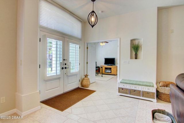3288 Spruce Creek Gln, Port Orange, FL 32128 - foyer with french doors, light tile patterned floors, and a ceiling fan