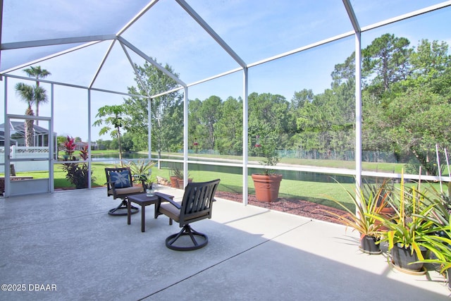 3288 Spruce Creek Gln, Port Orange, FL 32128 - view of patio with glass enclosure, a water view, and view of wooded area
