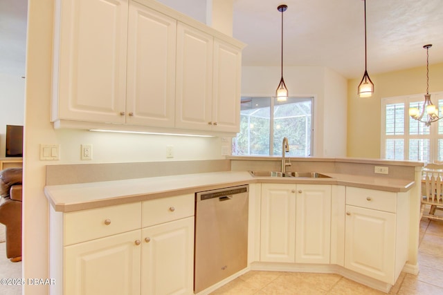 3288 Spruce Creek Gln, Port Orange, FL 32128 - kitchen featuring stainless steel dishwasher, a chandelier, a peninsula, light countertops, and hanging light fixtures
