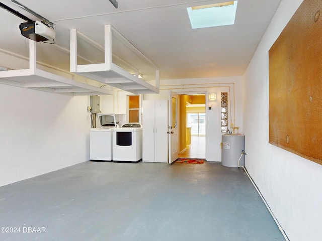 garage featuring a garage door opener, gas water heater, electric panel, and washer and clothes dryer