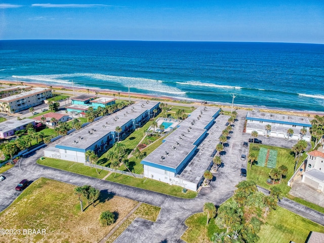 aerial view with a water view and a view of the beach