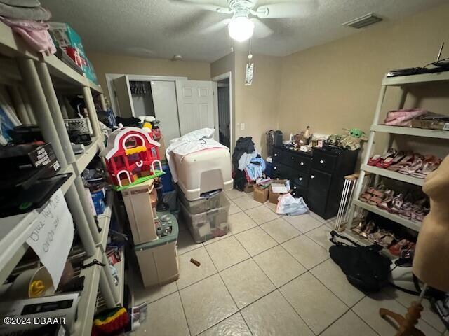 storage area featuring ceiling fan