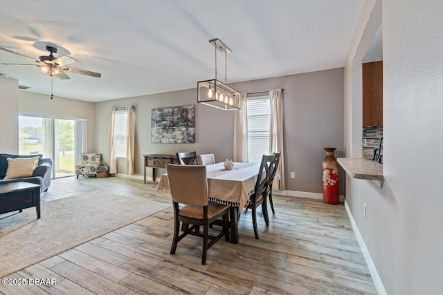 1743 Savannah Ln, Port Orange, FL 32128 - dining space featuring ceiling fan and light wood-type flooring