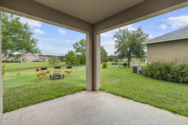 1743 Savannah Ln, Port Orange, FL 32128 - view of grassy yard featuring a patio area and an outdoor fire pit