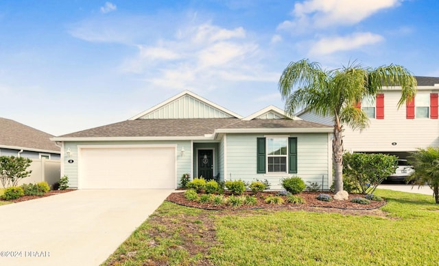 view of front of home featuring a garage and a front yard