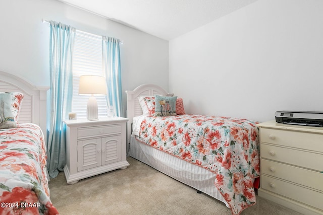 carpeted bedroom featuring multiple windows