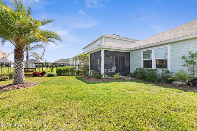 view of yard featuring a sunroom