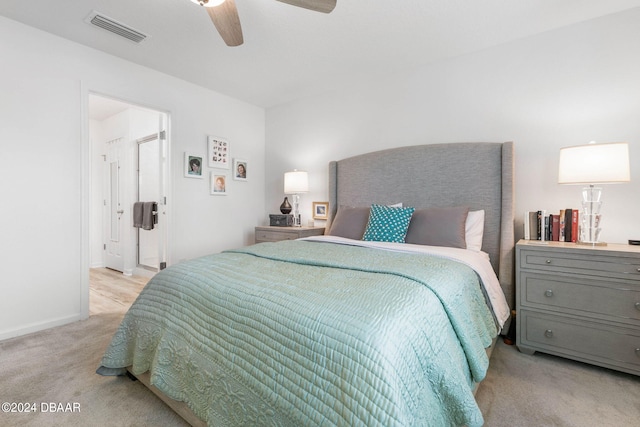 bedroom with light colored carpet and ceiling fan