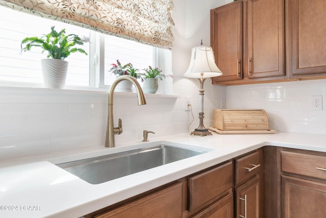 kitchen with backsplash and sink